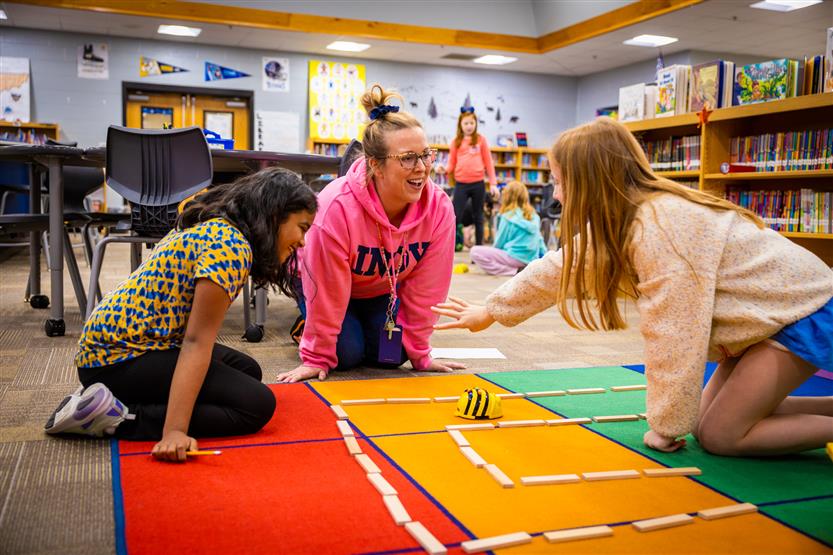 Students use Bee-Bots in the Learning Commons
